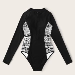 Zip front, long sleeved, one piece swimsuit